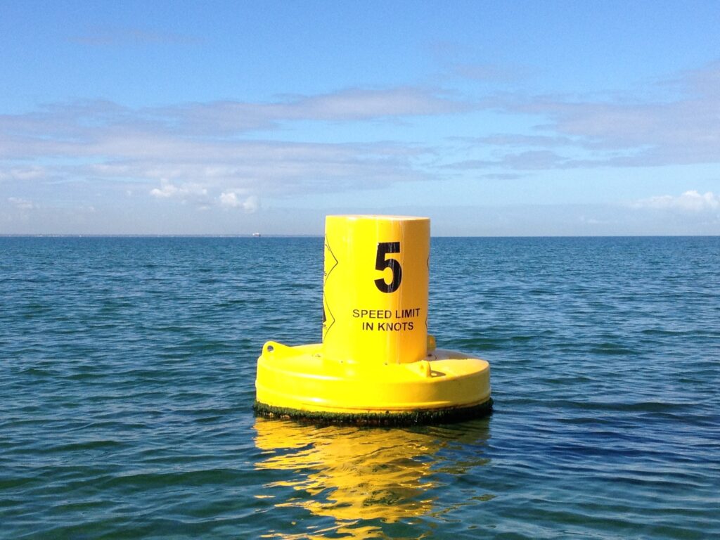Yellow buoy floating on the water